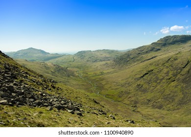 View From Wrynose Pass Looking Down The Valley To Hard Knott And Cockley Beck In The Lake District, UK, Taken During An Annual Cycling Challenge.