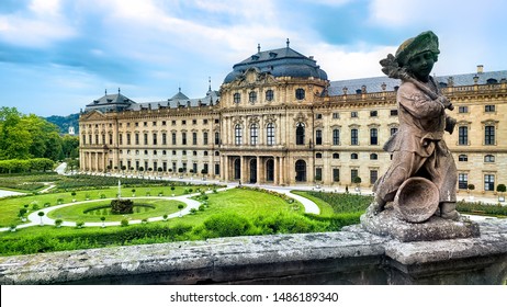View of the Wurzburg Residenz palace from its gardens with statue, Wurzburg Germany