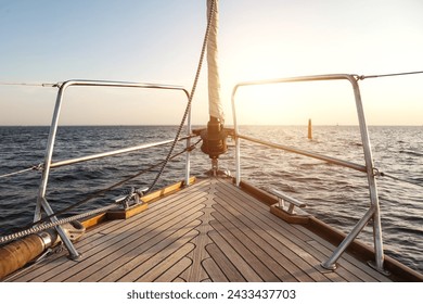 View from yacht's bow sailing towards horizon (skyline) at sunset, serene sunrise scene. Sailing into sunset on open sea, scenery photography. Travel sea cruise concept. Copy ad text space - Powered by Shutterstock