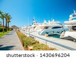 View of the Yalikavak Bodrum Marina, sailing boats and yachts in Bodrum town, city of Turkey. Shore and coast of Aegean Sea with yachts and boats