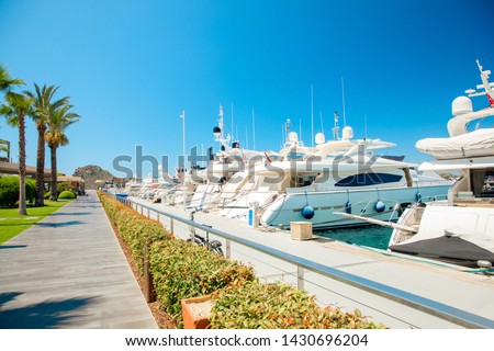 View of the Yalikavak Bodrum Marina, sailing boats and yachts in Bodrum town, city of Turkey. Shore and coast of Aegean Sea with yachts and boats