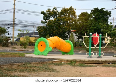 View Of The Yellow Tunnel Play For Children  And Exercise Equipment For Adults In The Park