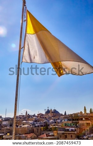 view and YellowWhite Half Flag on roof the Austrian Hospice of Holy Family, a refuge for itinerant pilgrims, was opened in 1854 by Catholic Church of Austria in Holy Land. Jerusalem, Israel