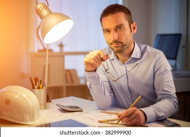 View Of A Young Attractive Architect Working Late At Office