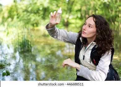 View Of A Young Attractive Biologist Woman Working On Water Analysis