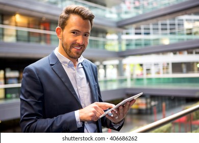 View Of A Young Attractive Business Man Using Tablet