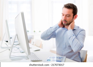 View Of A Young Attractive Man Got A Neck Pain At The Office