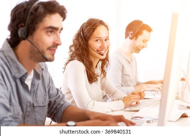 View of a Young attractive man working in a call center