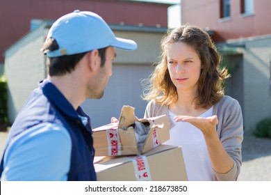 View of a Young attractive woman angry against delivery man