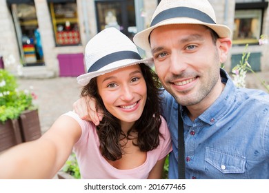 View of a Young couple on holidays taking selfie - Powered by Shutterstock