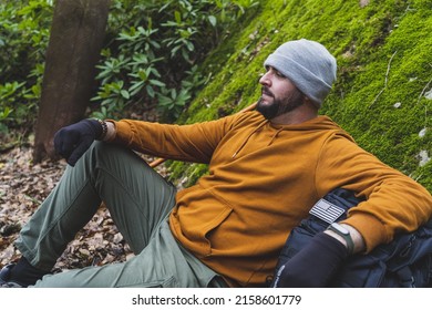 A View Of The Young Male Hiker Relaxing In The Forest