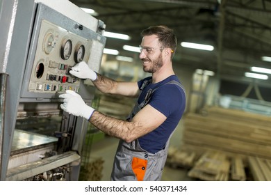 View at young man works in a factory for the production of furniture - Powered by Shutterstock