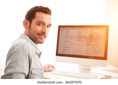 View of a Young relaxed man using tablet at home 