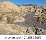 View of Zabriskie Point and Gower Gulch from the Badlands in Death Valley National Park, California