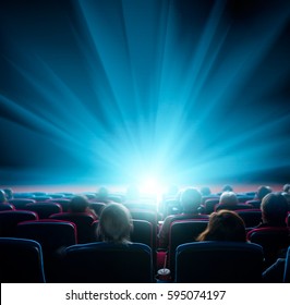 Viewers Watch Shining Light At The Cinema, Long Exposure, Blue Glow