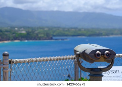Viewfinder Binoculars Overlooking A Scenic Island Ocean Vista