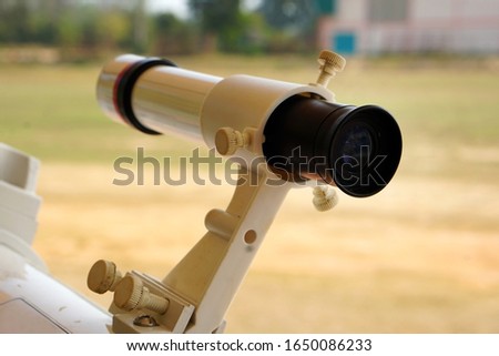 viewfinder of telescope, viewfinder of refracting device instrument for land lunar or planetary observation of distant object, magnified by lenses. 