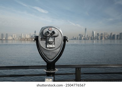 Viewing binoculars overlooking New York, Manhattan from Liberty Island