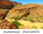 Viewing platform overlooking Ormiston Gorge in dry season. Northern Territory, Outback Red Center. Lookout platform aerial view along Ghost Gum walk in West MacDonnell Ranges, Central Australia.