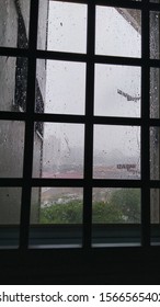 viewing through window grill when its raining - Shutterstock ID 1566565402