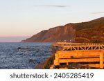 viewpoint of the coast on the golden hour with bright light and water