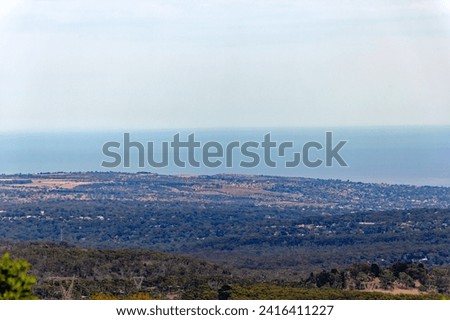 Viewpoint at Mount Lofty with beautiful aerial view over Australian City of Adelaide with Pacific Ocean in the background on a sunny summer day. Photo taken February 16th, 2012, Adelaide, Australia.