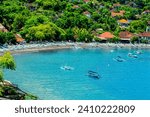 Views of Amed - ocean, bay, houses, traditional fishing boats jukung, Karangasem Regency, Bali, Indonesia