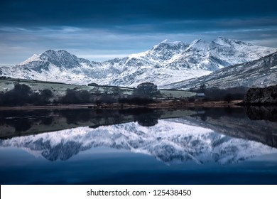 Views Around Snowdonia In Winter With Frozen Lakes And Snow On The Ground North Wales