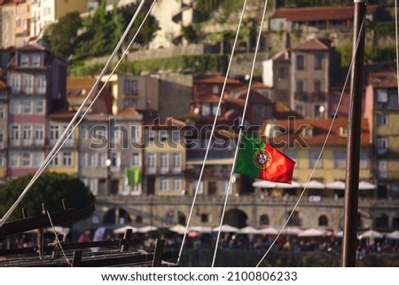 Similar – Image, Stock Photo Portuguese flag on boat in front of old town of Porto / Portugal