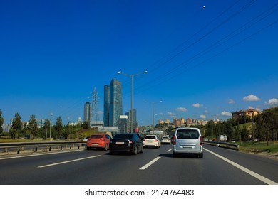 views of the highway on a sunny day in summer. Buildings and roads and cars.
