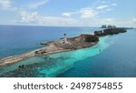 Views of the islan of Nassau, Bahamas. Beautiful green and blue colors of the sea and the light house. Horizontal photo.