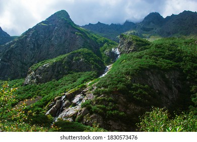 Views midagrabin waterfalls in North Ossetia. Beautiful landscape with rocks. Fog at the top of the mountains.  - Shutterstock ID 1830573476
