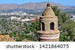 Views from Mount Rubidoux of Riverside, Calif. with the Peace Bridge and Tower monument in the foreground, built in 1925.  Urban development has filled the valley below.