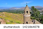 Views from Mount Rubidoux of Riverside, Calif. with the Peace Bridge and Tower monument in the foreground, built in 1925.  Urban development has filled the valley below.