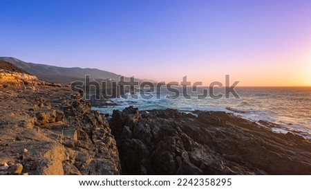 views of the rugged beaches of Betancuria at sunset