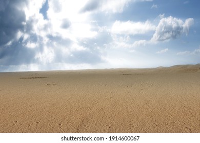 Views Of Sand Dune With A Blue Sky Background