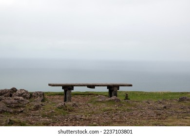 Views from the top of the Great Orme, Llandudno in Conwy, wooden bench overlooking ocean - Powered by Shutterstock