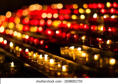 Vigil Candles In French Monastery With Bokeh