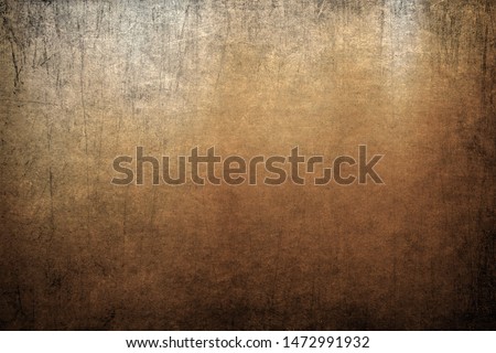 Vignette grunge scratched background, golden color texture