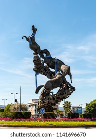 Vigo, Spain - May 20, 2017: Horse Sculpture In Spain Square (Plaza De Espana) Of Vigo City, Galicia, Spain. Football Shirts Hanging.