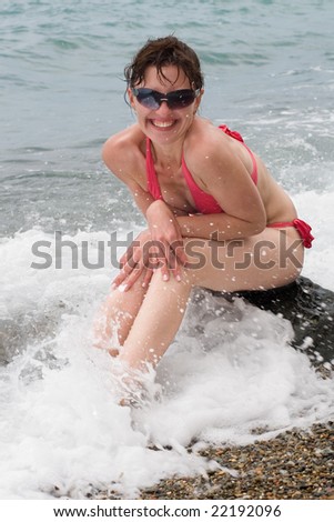 Vigorous young woman at the sea