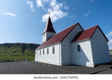 
Vik i Myrdal Church, little white church with a bright red roof which sits atop a hill above Vík, Iceland. Built in 1929. September 1, 2023. - Powered by Shutterstock