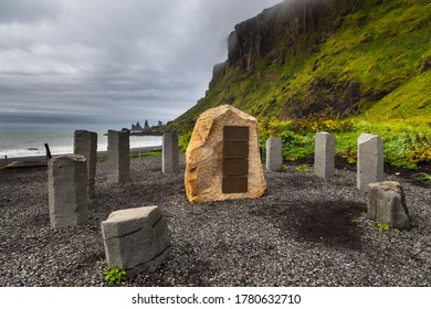 Vik And Myrdal, Iceland - 23 August 2015: Stone Circle On The Black, Volcanic Beach. Reynisdrangar Rock Formation In The Background.