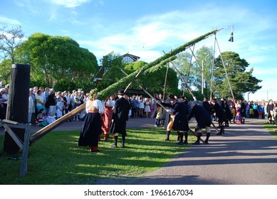 Vikarbyn, Sweden - June 22 2012: Traditional raising of maypole at Midsummer Eve in Vikarbyn, Dalarna, Sweden 