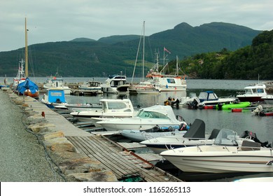 Vikedal, Norway - June 16, 2018: Motor boats in Vikedal marina, a strand area with a long tradition. Bathing area, guest harbour and salmon river.