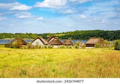 Viking village Haithabu, Busdorf, Schleswig-Holstein, Germany, Europe. 
Reconstructed Viking thatched houses on the basis of archaeological finds in Viking Haithabu village.