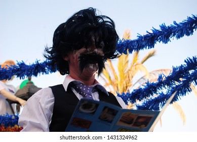 Vila Real De Santo António, Algarve, Portugal, 28th February 2017, Carnival Masked Man Reading A Fast Food Menu