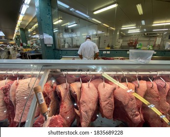 Vila Velha, Espirito Santo, Brazil - 10/17/20 - Employee Cuts Meat At The Butcher Shop Inside The Supermarket