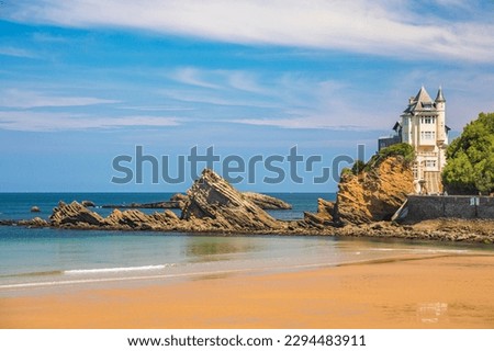 Villa Belza and rocks of the Cote des Basques beach in Biarritz, France on a summer day