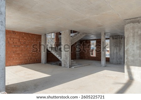 Villa construction, monolithic frame construction, empty unfinished room
